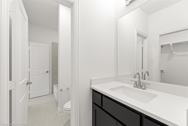full bathroom featuring toilet, tile patterned flooring, and vanity