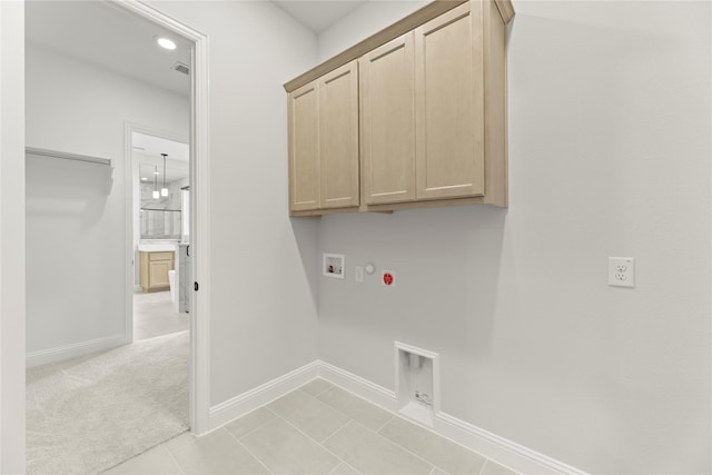 2206 Stratford Rd, Rockwall, TX 75087 - laundry area featuring gas dryer hookup, hookup for a washing machine, cabinet space, and baseboards