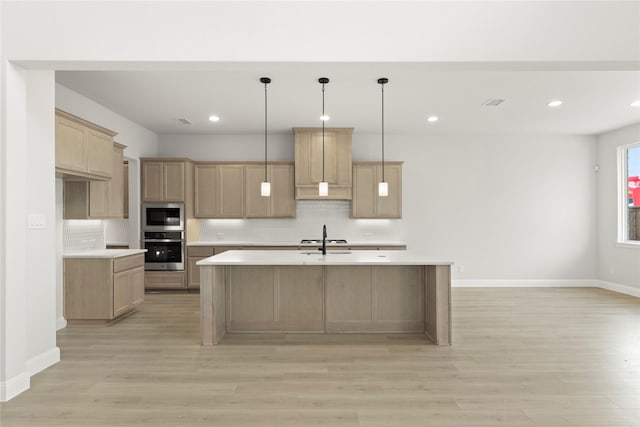 2206 Stratford Rd, Rockwall, TX 75087 - kitchen with appliances with stainless steel finishes, light countertops, tasteful backsplash, light wood finished floors, and baseboards