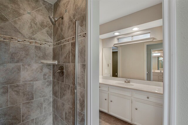 bathroom with vanity and a stall shower