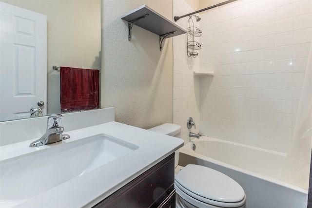 bathroom with vanity, shower / bath combo with shower curtain, and toilet