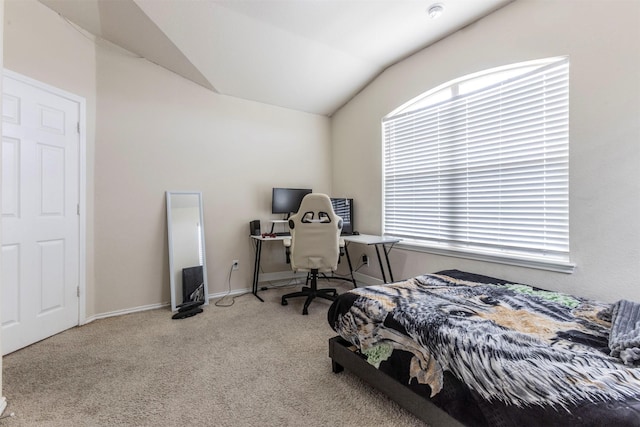 bedroom featuring baseboards, carpet, and vaulted ceiling