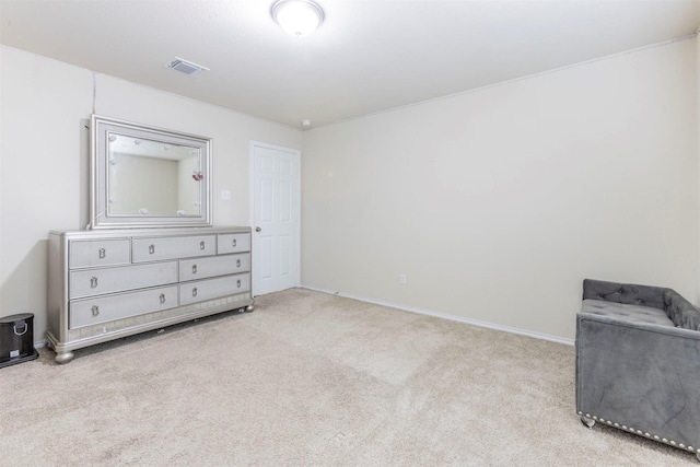 unfurnished bedroom with visible vents, baseboards, and carpet floors