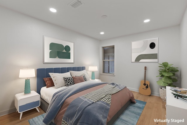 1717 Anderson St, Irving, TX 75062 - bedroom featuring light wood finished floors, baseboards, and recessed lighting