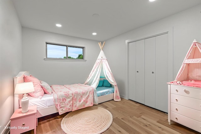 1717 Anderson St, Irving, TX 75062 - bedroom featuring wood finished floors, a closet, and recessed lighting