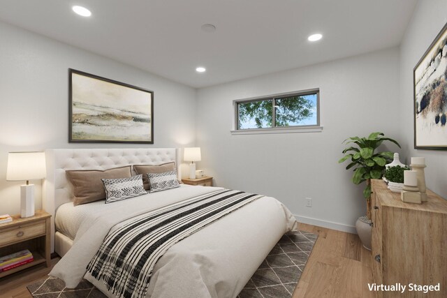 bedroom featuring wood finished floors, recessed lighting, and baseboards