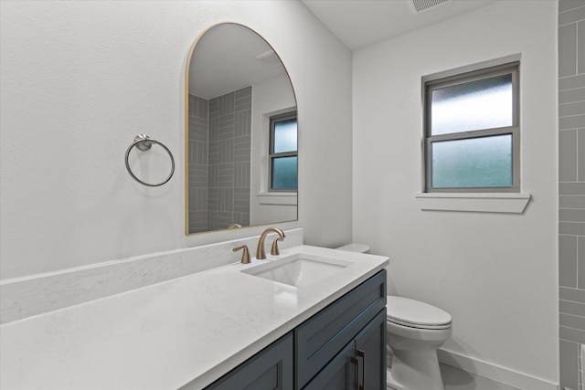 1717 Anderson St, Irving, TX 75062 - full bath with vanity, toilet, and plenty of natural light
