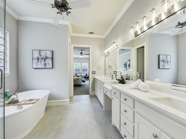 bathroom with visible vents, double vanity, a soaking tub, a ceiling fan, and ensuite bath
