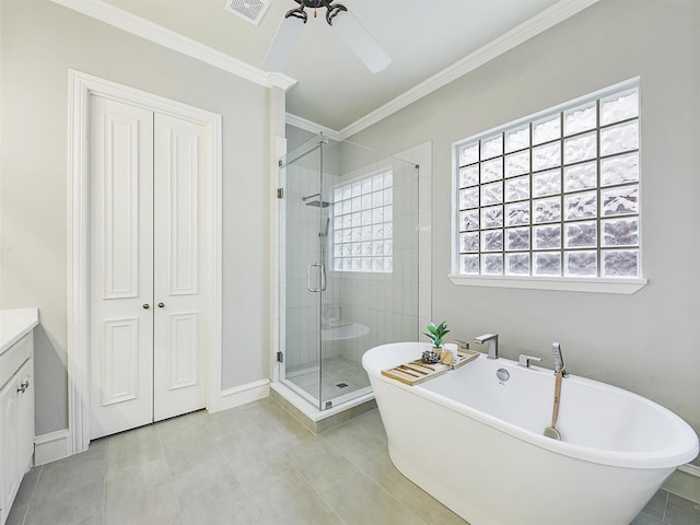 bathroom with visible vents, vanity, ceiling fan, a soaking tub, and a stall shower