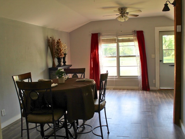 dining room with a ceiling fan, vaulted ceiling, and a wealth of natural light