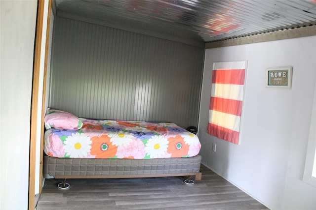bedroom with wood finished floors