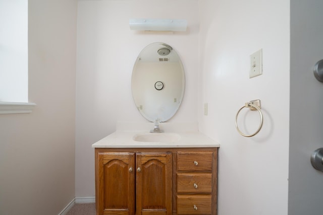 bathroom featuring vanity and baseboards