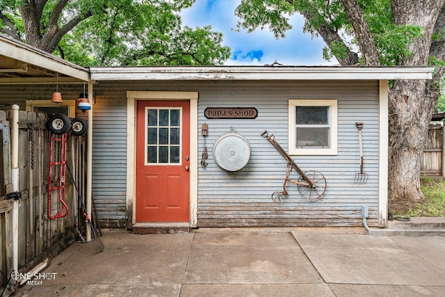 view of exterior entry featuring a patio