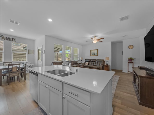 1151 Rumble Ln, Fate, TX 75087 - kitchen featuring visible vents, a sink, light wood-style flooring, and dishwasher