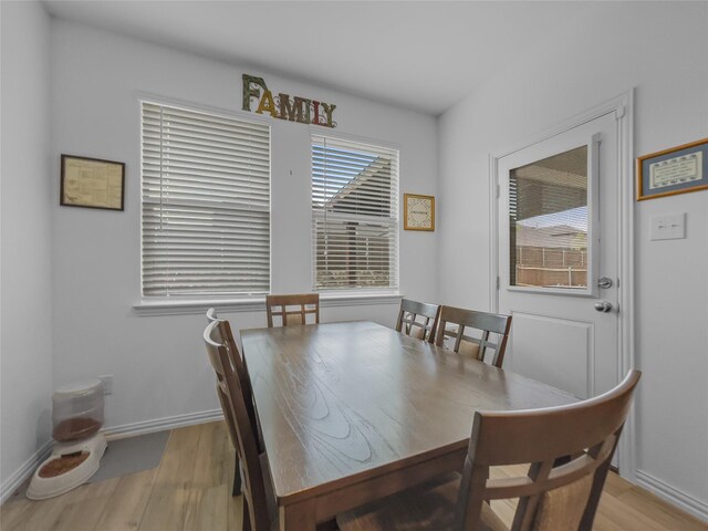 1151 Rumble Ln, Fate, TX 75087 - dining room featuring baseboards and light wood-style flooring