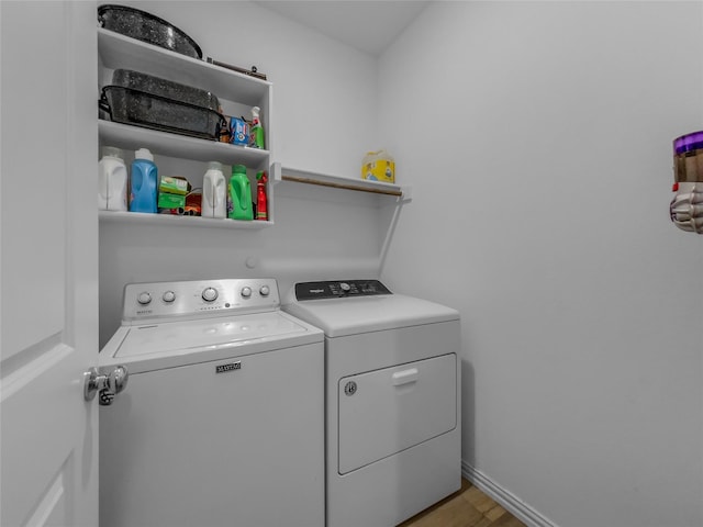 1151 Rumble Ln, Fate, TX 75087 - laundry room with separate washer and dryer, baseboards, laundry area, and light wood finished floors