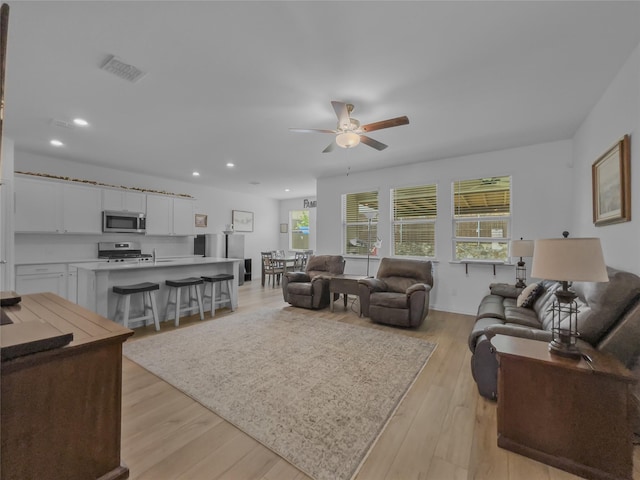 1151 Rumble Ln, Fate, TX 75087 - living area featuring plenty of natural light, a ceiling fan, visible vents, and recessed lighting