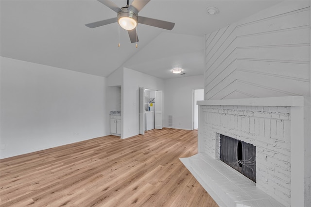 6040 Stoneybrook Dr, Fort Worth, TX 76112 - unfurnished living room with ceiling fan, visible vents, a fireplace, vaulted ceiling, and light wood-style floors