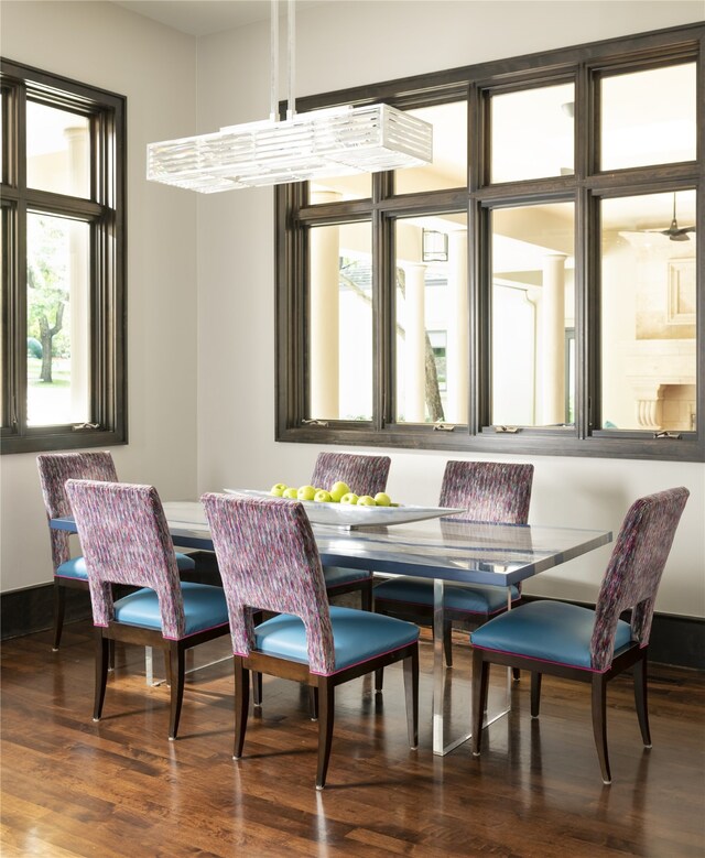 dining space with dark wood-type flooring