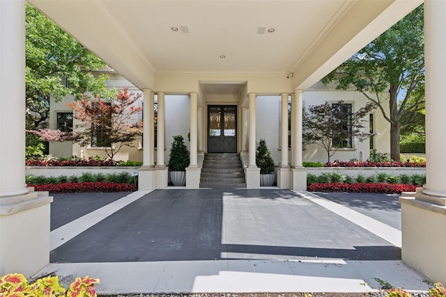 6800 High Gate Rd, Plano, TX 75024 - entrance to property with stucco siding and uncovered parking