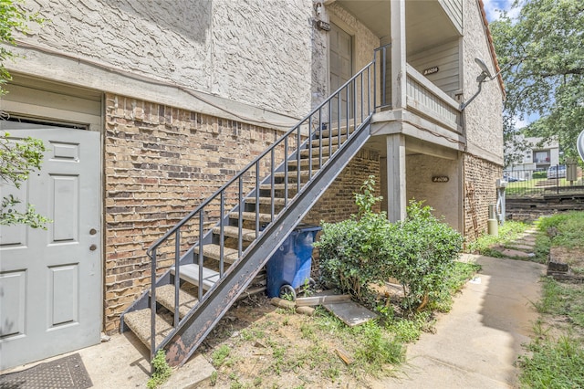 6034 Stoneybrook Dr, Fort Worth, TX 76112 - doorway to property with brick siding