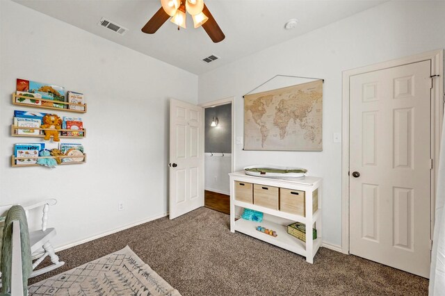 bedroom with baseboards, visible vents, and carpet