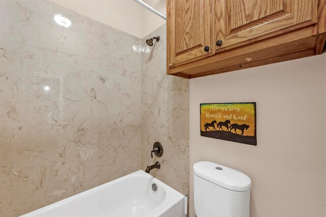 bathroom with toilet and tub / shower combination