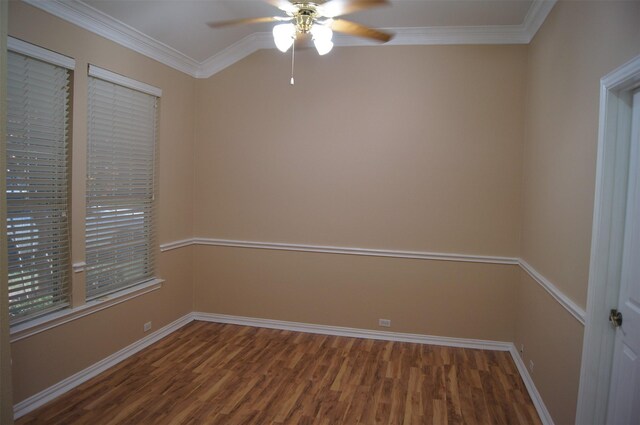 spare room with crown molding, baseboards, a ceiling fan, and wood finished floors