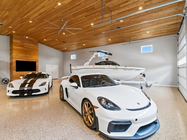 garage featuring baseboards, recessed lighting, a ceiling fan, and wooden ceiling