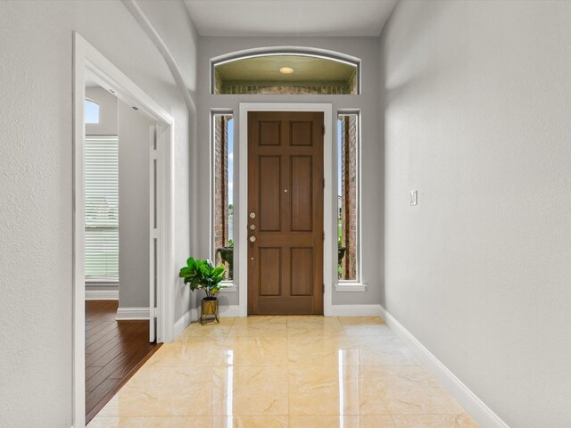 foyer entrance with baseboards