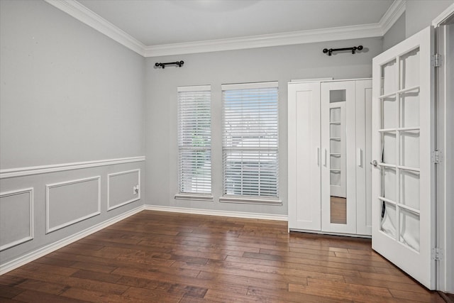 unfurnished room featuring crown molding and hardwood / wood-style flooring