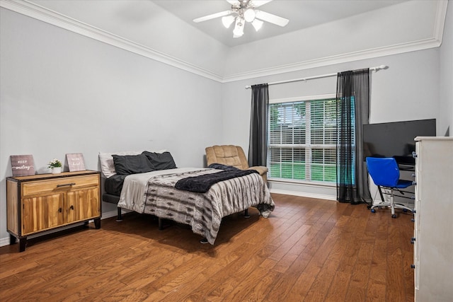 bedroom with baseboards, ceiling fan, dark wood-style floors, and ornamental molding
