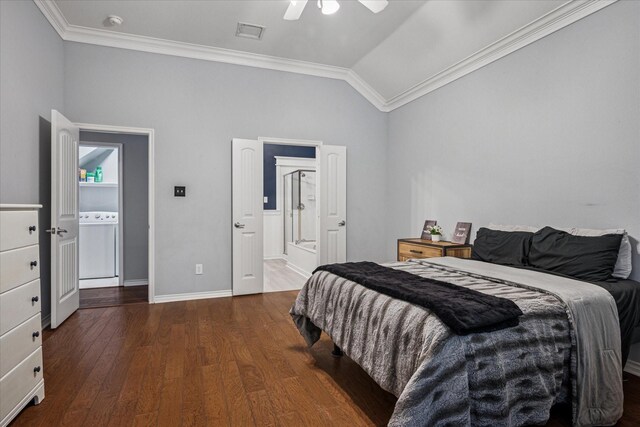 bedroom featuring visible vents, ornamental molding, washer / dryer, wood finished floors, and vaulted ceiling