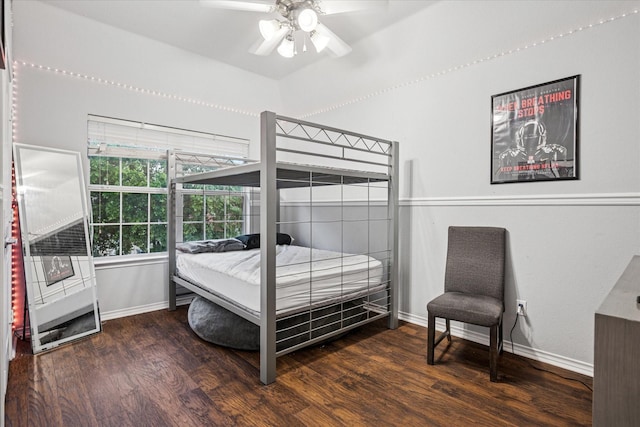 bedroom with baseboards, ceiling fan, and wood finished floors