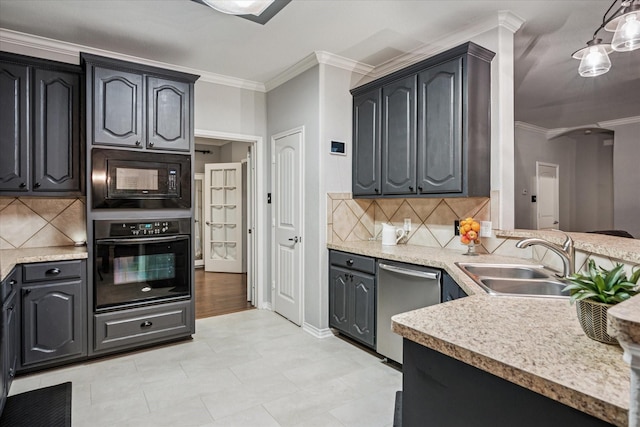 kitchen featuring crown molding, light countertops, a sink, backsplash, and black appliances