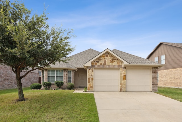ranch-style home featuring an attached garage, a front lawn, roof with shingles, and driveway