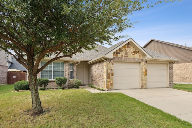 ranch-style house with an attached garage, driveway, roof with shingles, and a front lawn