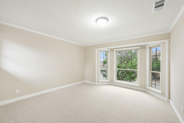spare room with visible vents, ornamental molding, baseboards, light colored carpet, and a textured ceiling