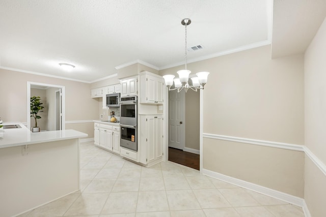kitchen featuring visible vents, pendant lighting, light countertops, an inviting chandelier, and stainless steel appliances