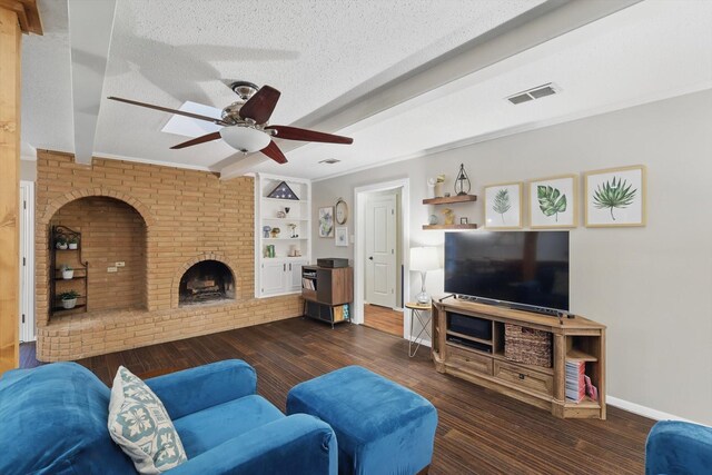 living area featuring a ceiling fan, a textured ceiling, visible vents, beam ceiling, and wood finished floors