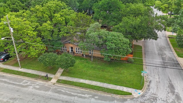 birds eye view of property with a forest view