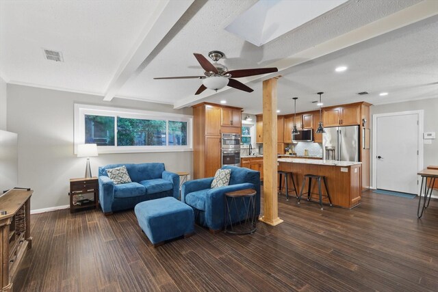 living area with a ceiling fan, dark wood-style flooring, visible vents, baseboards, and recessed lighting