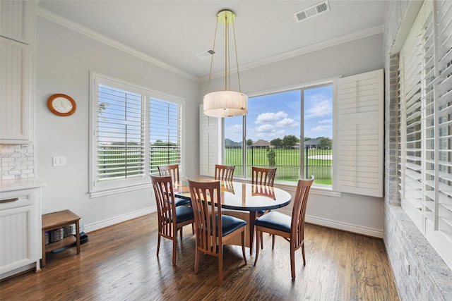 dining area featuring baseboards, plenty of natural light, and visible vents