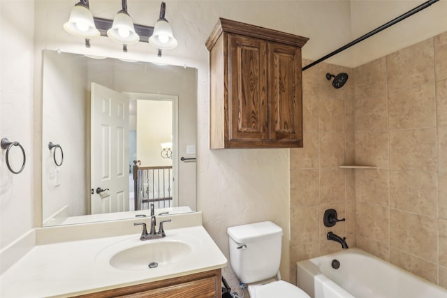 bathroom with vanity, toilet, and bathing tub / shower combination