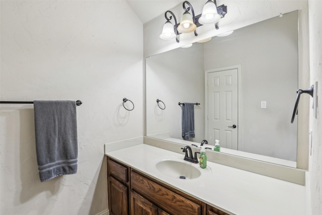 bathroom with baseboards and vanity