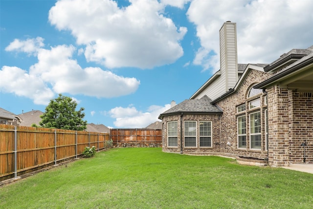 view of yard featuring a fenced backyard