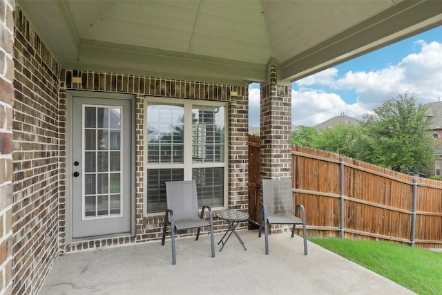 view of patio / terrace featuring fence