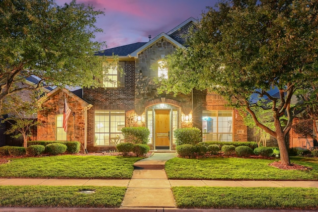 3501 Washington Dr, Frisco, TX 75034 - view of front of property featuring stone siding, a yard, and brick siding