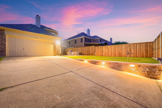 3501 Washington Dr, Frisco, TX 75034 - view of patio / terrace with driveway, fence, and a garage
