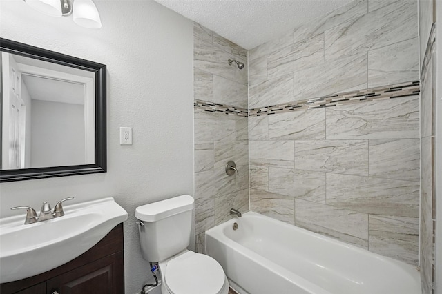 bathroom with vanity, shower / bathtub combination, toilet, and a textured ceiling